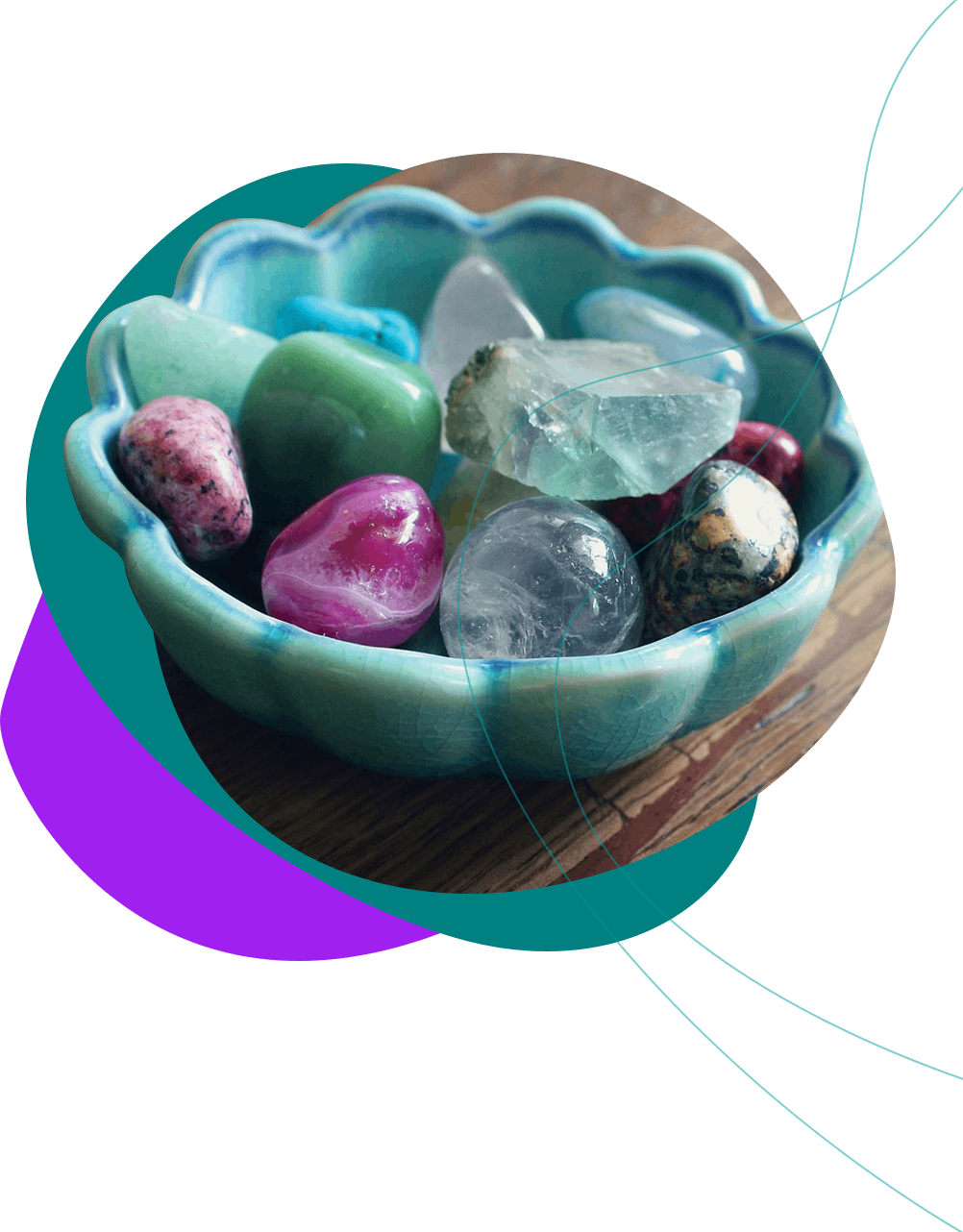 Crystals in a blue bowl on a wooden table.