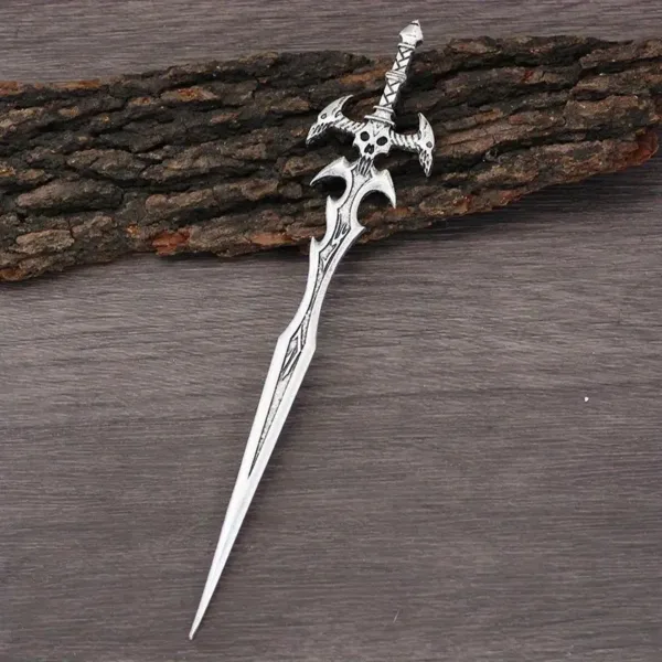 Ornate silver sword on wooden surface.