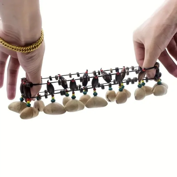 Seed pod musical instrument with beads.