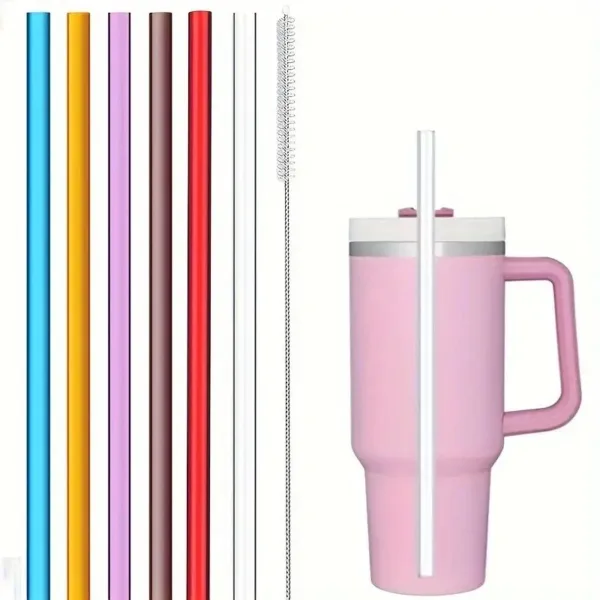 Pink tumbler with straws and cleaning brush.