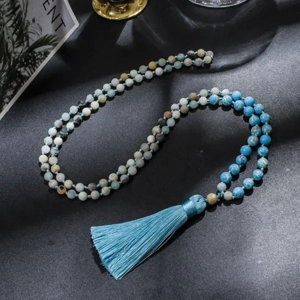 Blue and green beaded necklace with tassel.