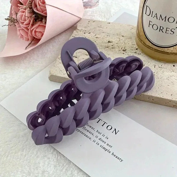 Purple plastic hair claw clip.