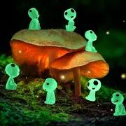 Glowing creatures on a mushroom in a forest.