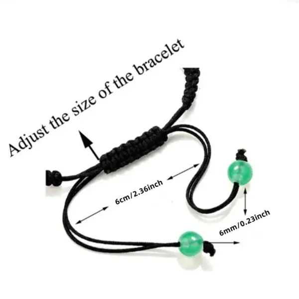 Adjustable green bead bracelet with black cord.