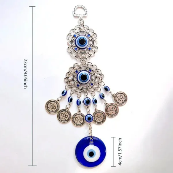 Silver evil eye charm with beads and coins.