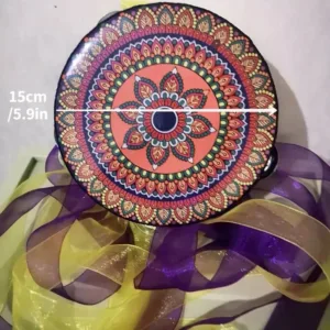 Colorful mandala tambourine with ribbons.