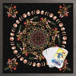 Tarot card on tapestry with moon phases.