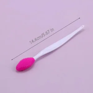 Pink silicone face cleansing brush.