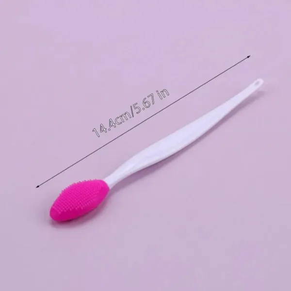 Pink silicone face cleansing brush.