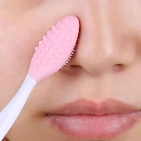 Pink silicone brush on nose and mouth.