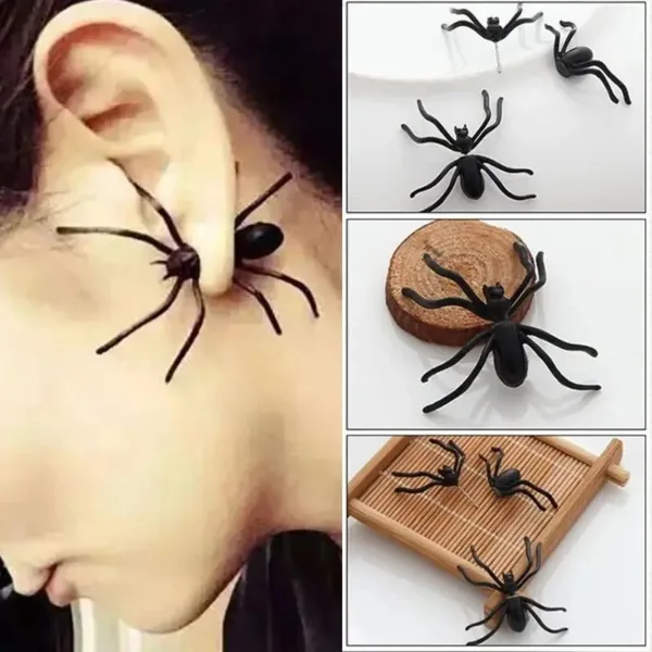 Black spider earrings on a person's ear.