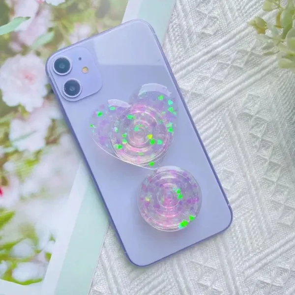 Purple phone case with glitter heart and circle.