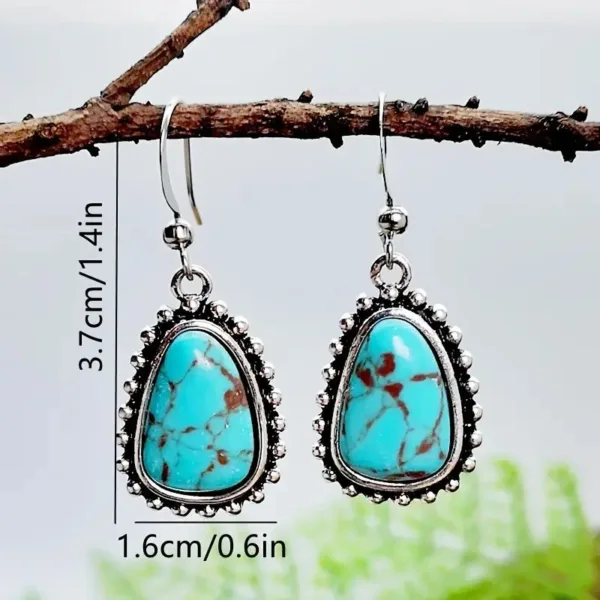 Turquoise stone silver dangle earrings.