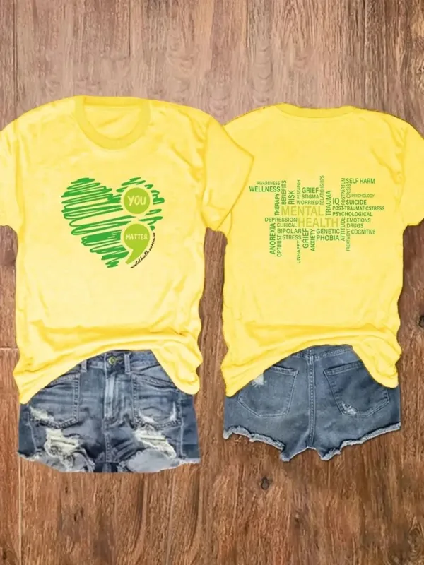 Yellow t-shirt with green heart and "you matter" text.