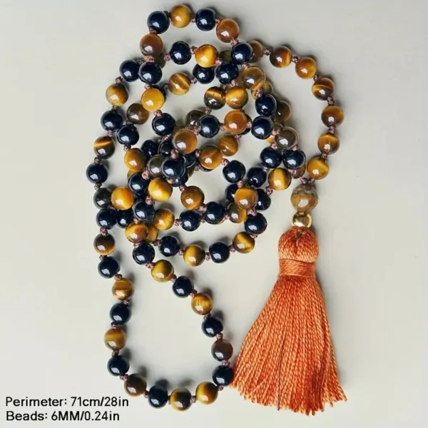 Black and tiger eye beaded necklace with tassel.