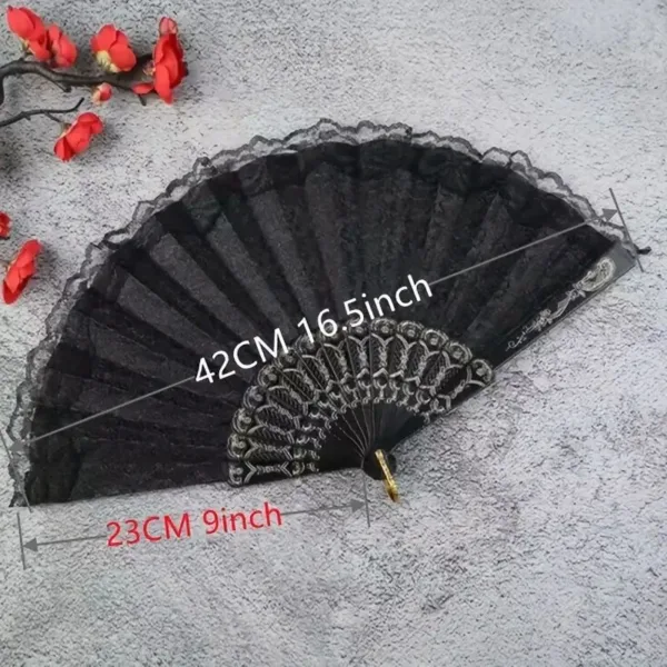 Black lace hand fan with gold design.