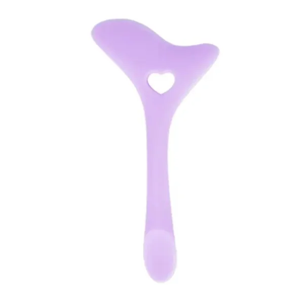 Purple silicone facial massage tool with heart.