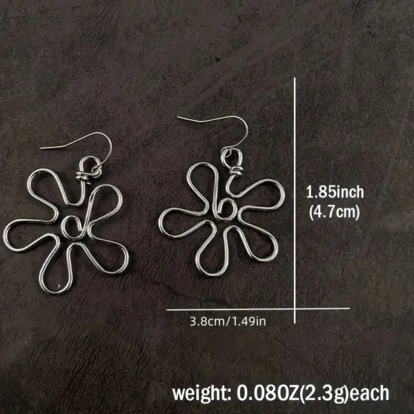 Silver flower shaped wire earrings.