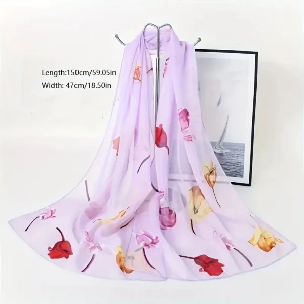 Purple floral chiffon scarf on hanger.