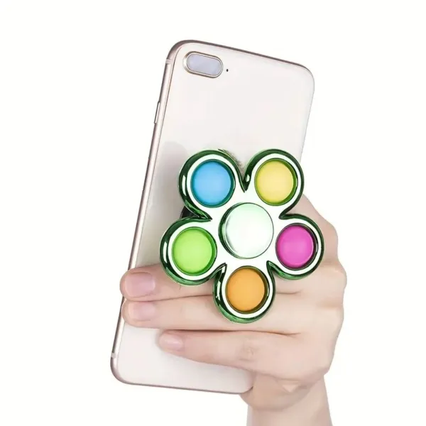 Colorful fidget spinner on a phone.