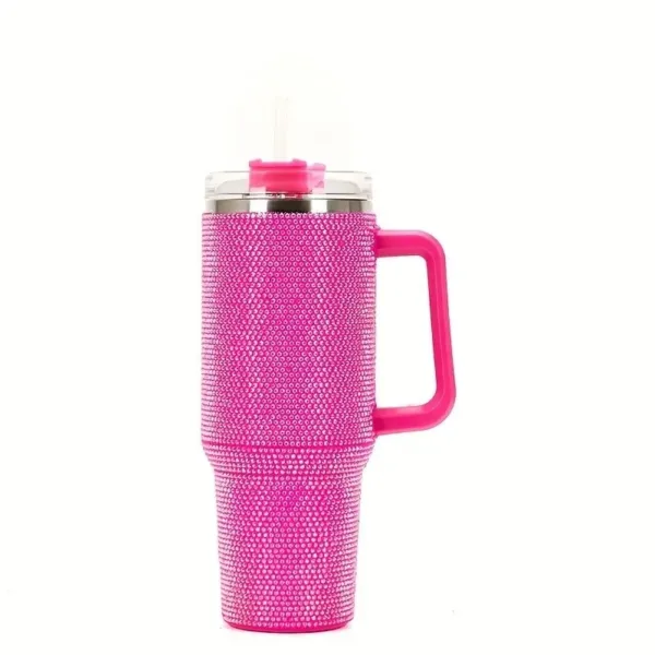 Pink rhinestone tumbler with handle and straw.