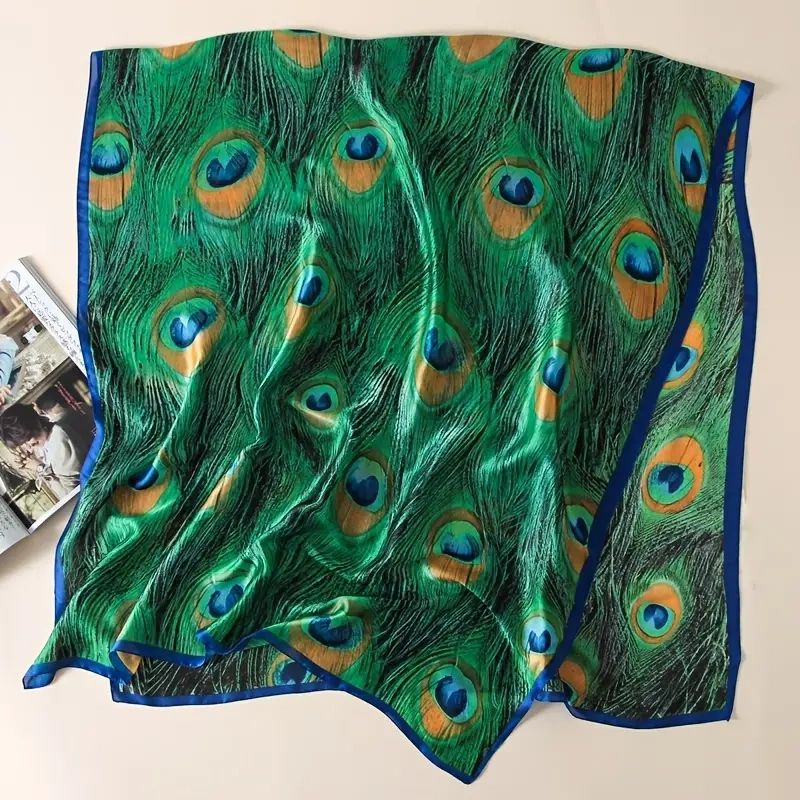 Green silk scarf with peacock feathers.