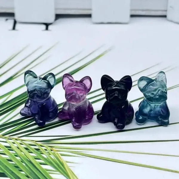 Four crystal dog figurines in different colors.