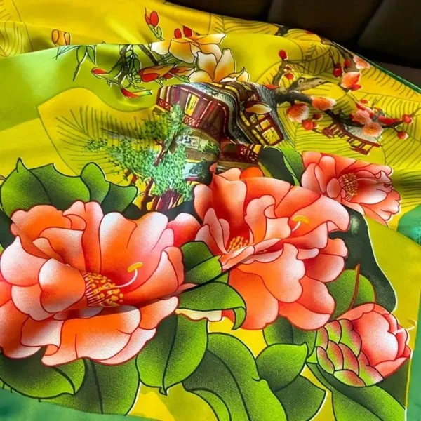 Yellow silk scarf with floral design.