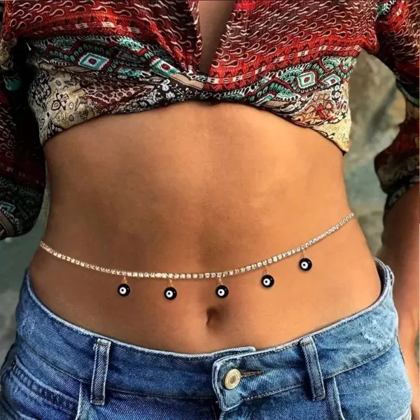 Rhinestone belly chain with evil eye charms.