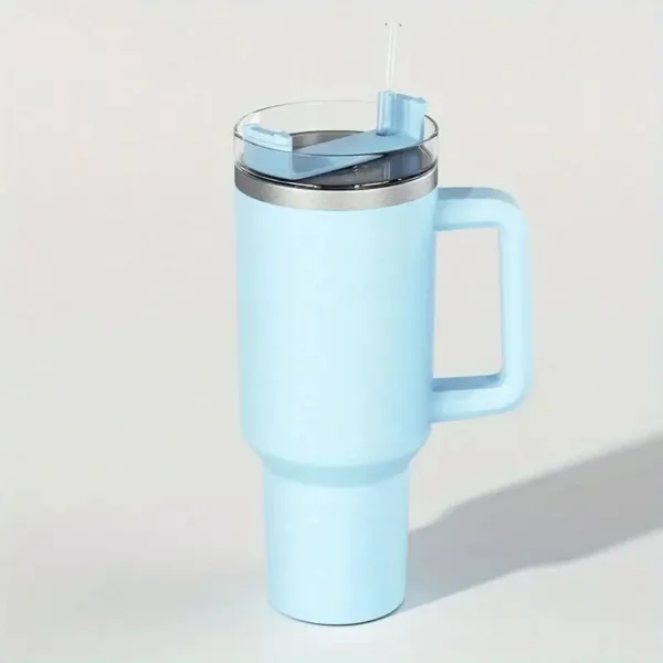 Light blue travel mug with handle.