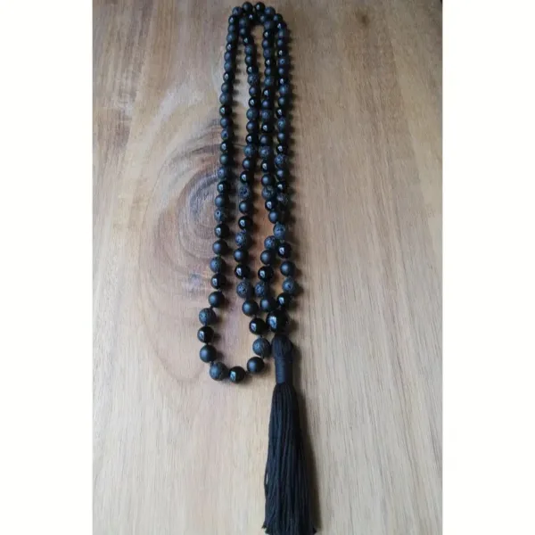 Black beaded necklace with tassel.