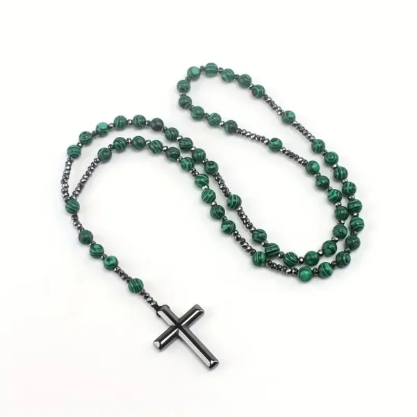 Green and black beaded necklace with cross pendant.