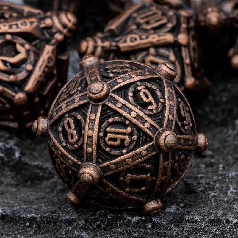 Copper and brass numbered dice.