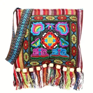 Colorful embroidered shoulder bag with fringe.