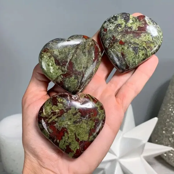 Three green and red heart-shaped stones.