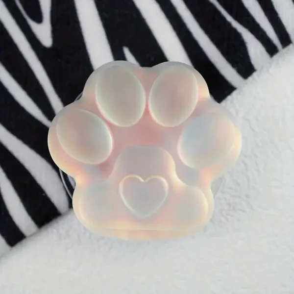 White paw print with heart in center.