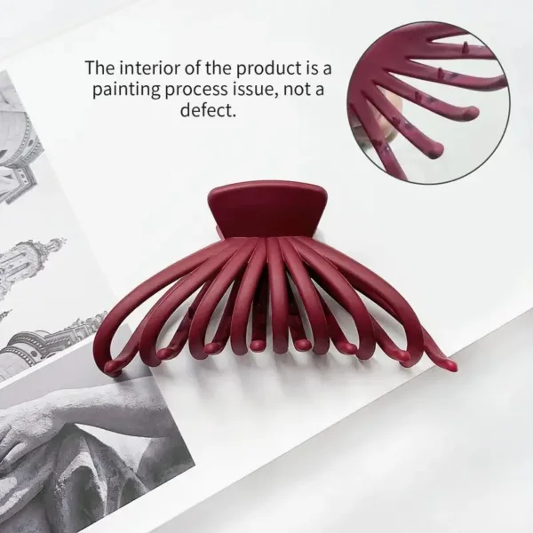 Burgundy plastic octopus hair claw clip.