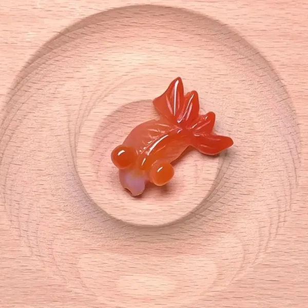 Red carnelian carved goldfish figurine.