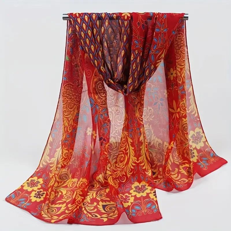 Red and gold patterned chiffon scarf.