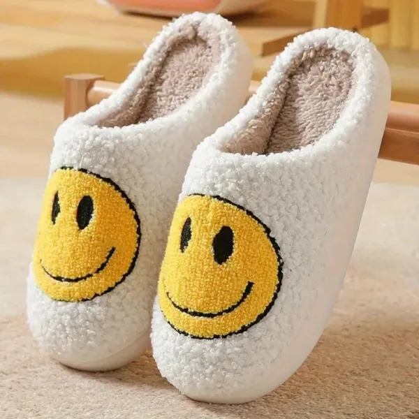 White fuzzy slippers with smiley faces.