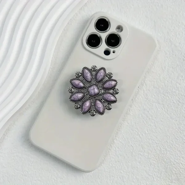 White phone case with jeweled ring holder.