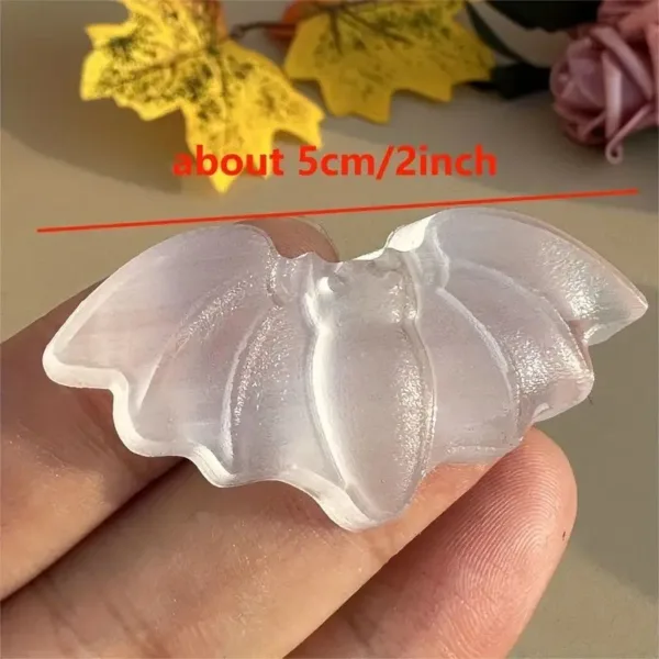 White plastic bat-shaped mold.