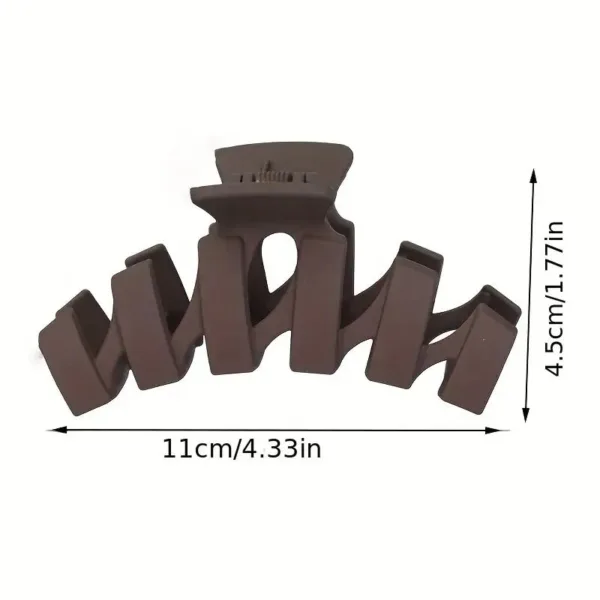 Brown plastic hair claw clip.