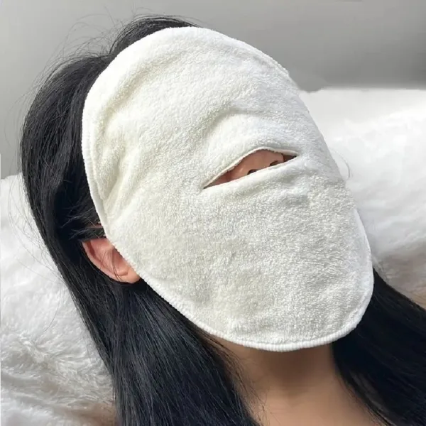 Woman wearing a white eye mask.