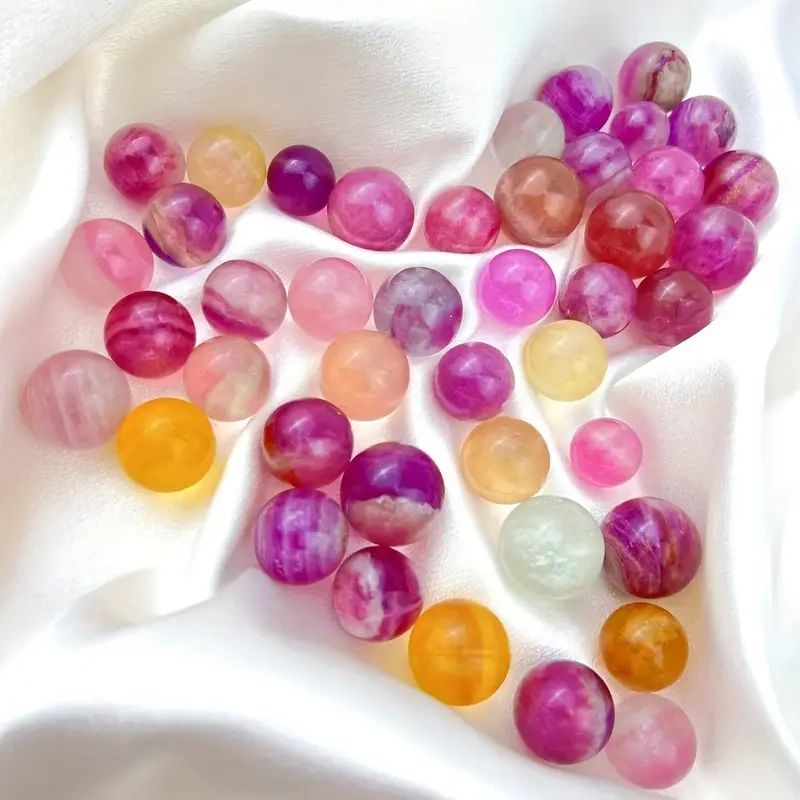 Pink and white agate gemstone spheres.