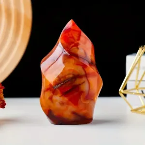 Red carnelian crystal shaped like a flame.