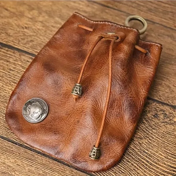 Brown leather drawstring pouch with metal accents.