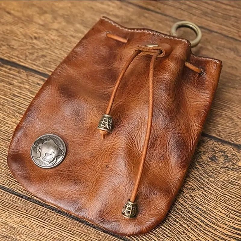 Brown leather drawstring pouch with metal accents.