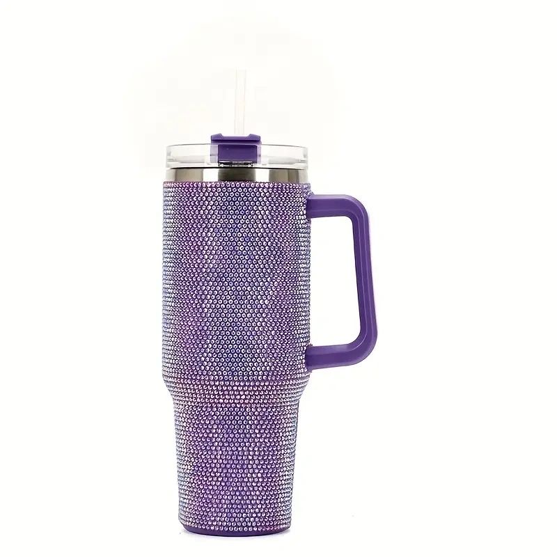 Purple rhinestone tumbler with handle and straw.