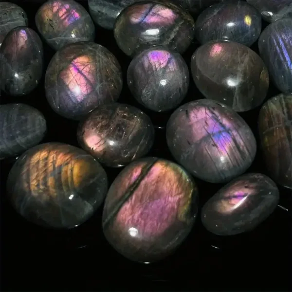 Purple labradorite tumbled stones.